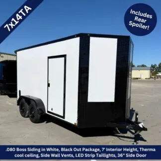 Enclosed white cargo trailer with dual axles and a side door, parked in a lot.