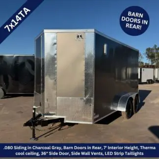 Enclosed tandem-axle cargo trailer with rear barn doors, diamond-plate trim, shown on a dealership lot.