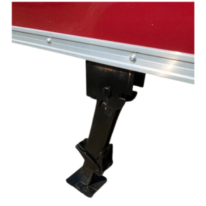 The front end of a red Fold Down Stabilizer Jacks.