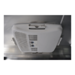 A white 13,500 BTU AC with Heat Strip mounted on the side of a refrigerator.