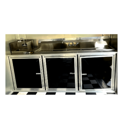 A black and white kitchen with a checkered floor.