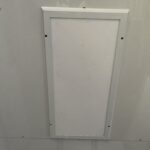A white panel on the ceiling of a room.