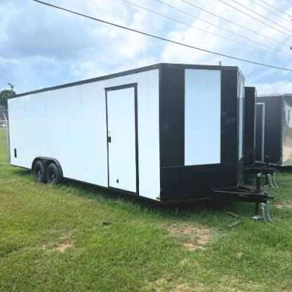 A trailer that is parked in the grass.