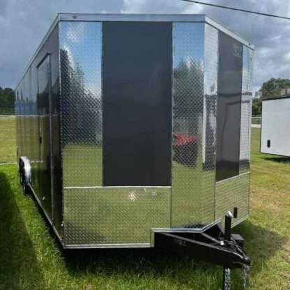 A trailer that is parked in the grass.