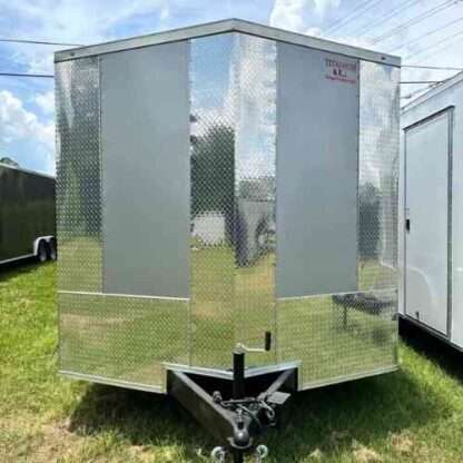 A trailer that has been painted silver.