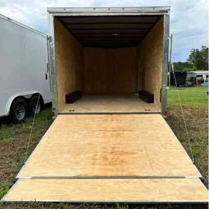 A trailer with two large doors and one small door.