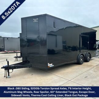 Black enclosed trailer, 8.5x20, dual 5200 lb torsion axles, extended tongue and escape door on a concrete lot.